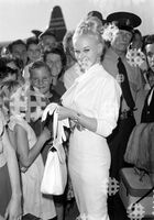 September 14, 1959. Brisbane, QLD. Movie actress Sabrina being met by fans after she arrives at Eagle Farm airport