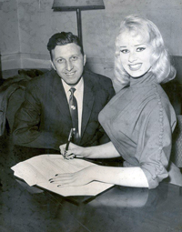 Sabrina signing her breast insurance policy 1957