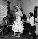 Sabrina takes a singing lesson with Maurice Burman