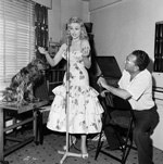 Sabrina takes a singing lesson with Maurice Burman