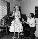 Sabrina takes a singing lesson with Maurice Burman