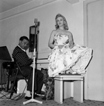 Sabrina takes a singing lesson with Maurice Burman