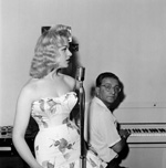 Sabrina takes a singing lesson with Maurice Burman