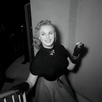 Sabrina with apple at a party for photographer