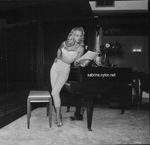 Sabrina near piano