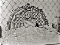 Sabrina in her satin bed