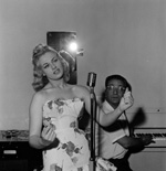 Sabrina takes a singing lesson with Maurice Burman