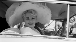 Sabrina arrives at the Ascot races 1957