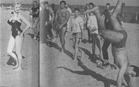 Sabrina watches beach man do handstand