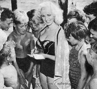 Sabrina signs autographs