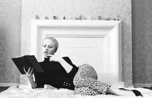 Sabrina in bed reading and thinking