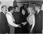 Artists who were to appear in last night's Royal Variety Performance at the London Palladium discussing the decision to cancel the show because of the international situation. L. to R.: Jerry Colonna, Harry Secombe, Liberace, Beryl Reid and Sabrina.