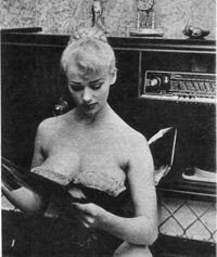 Sabrina reading a record cover